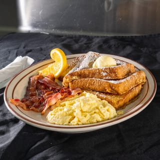 3 French Toast, 4 Bacon or Sausage & 3 Eggs
