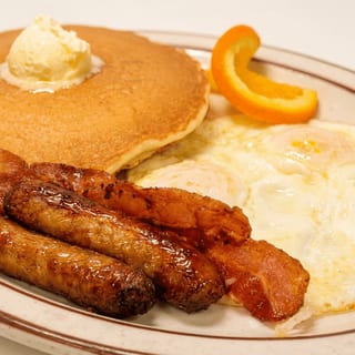 3 Big Hot Cakes, 4 Bacon or Sausage & 3 Eggs