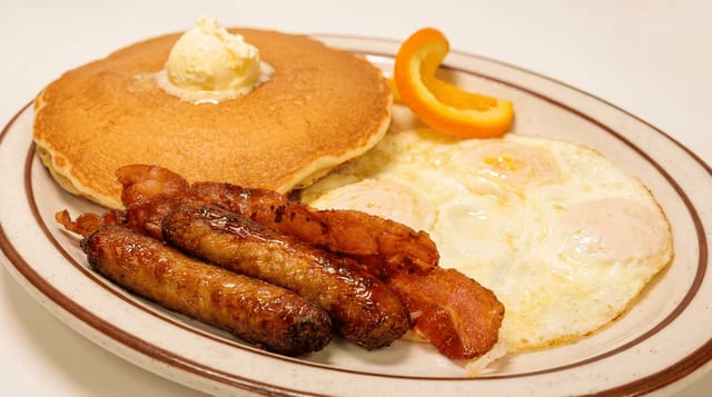 3 Big Hot Cakes, 4 Bacon or Sausage & 3 Eggs.